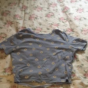 xs, light blue with daisy flower designs, two long straps to tie back.